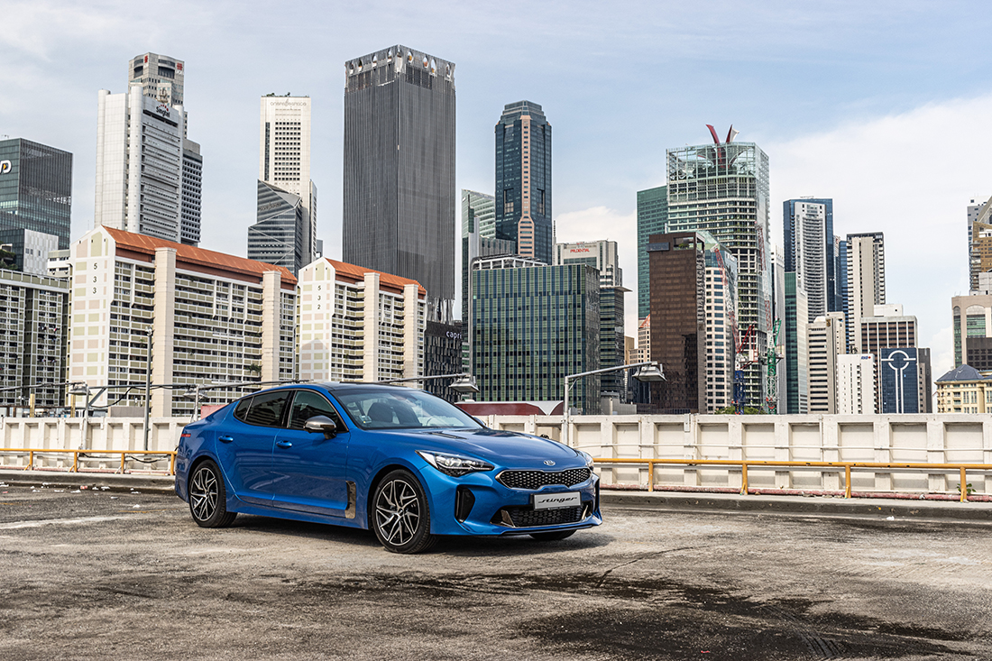 KIA Stinger 2.0 front right side blue view singapore skyline