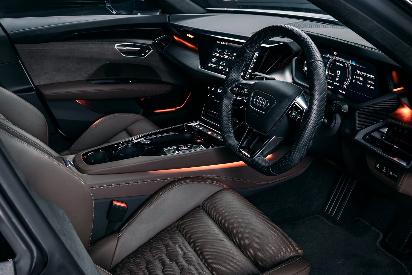 The cabin is familiar Audi territory... but features new EV-specific controls/displays